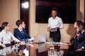 Businesswoman Leads Meeting Around Table Shot Royalty Free Stock Photo