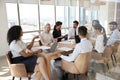 Businesswoman Leads Meeting Around Table Shot Through Door Royalty Free Stock Photo