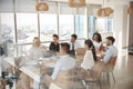 Businesswoman Leads Meeting Around Table Shot Through Door Royalty Free Stock Photo