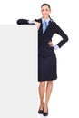 Businesswoman leaning on billboard Royalty Free Stock Photo