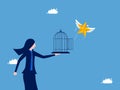 Businesswoman let the star fly out of the cage. emancipation and freedom