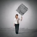 Businesswoman lifting heavy rock Royalty Free Stock Photo