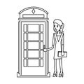 Businesswoman and london telephone cabin in black and white