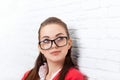 Businesswoman look up to copy space wear red jacket glasses think Royalty Free Stock Photo