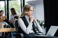 businesswoman looking away while thinking near