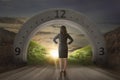 Businesswoman looking at green grass on the behind gateway arch Royalty Free Stock Photo