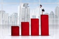 Businesswoman looking at the lower chart Royalty Free Stock Photo