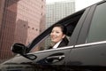 Businesswoman looking out car window