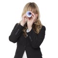 Businesswoman looking through a paper telescope