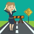 Businesswoman looking at road sign dead end. Royalty Free Stock Photo