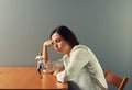 Businesswoman looking at small meditation woman