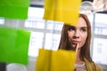 Businesswoman looking at sticky notes Royalty Free Stock Photo