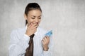 Businesswoman looks with great joy at the bank card