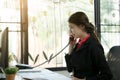 Businesswoman making a phone call.Talking on Landline phone.Concept for communication, contact us and customer service support Royalty Free Stock Photo