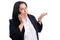 Businesswoman making phonecall with confused expression Royalty Free Stock Photo