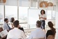 Businesswoman Making Presentation Shot Through Doorway Royalty Free Stock Photo