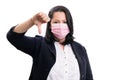 Businesswoman making thumb down gesture wearing medical mask Royalty Free Stock Photo