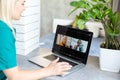 Businesswoman making video call to business partner using laptop. Close-up rear view of young woman having discussion Royalty Free Stock Photo