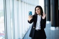 Businesswoman making video call to business partner using laptop, looking at screen with virtual web chat, contacting client by Royalty Free Stock Photo