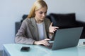 Businesswoman making video call to business partner using laptop. Young woman having discussion with corporate client. Remote job Royalty Free Stock Photo