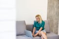 Businesswoman making video call to business partner using laptop. Close-up rear view of young woman having discussion Royalty Free Stock Photo