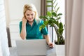 Businesswoman making video call to business partner using laptop. Close-up rear view of young woman having discussion Royalty Free Stock Photo