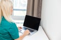 Businesswoman making video call to business partner using laptop. Close-up rear view of young woman having discussion Royalty Free Stock Photo