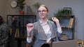 Businesswoman manager working on laptop at desk, dancing, celebrate victory achieved good job result Royalty Free Stock Photo