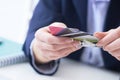 Businesswoman with many different credit cards in hands close-up. Cashless payments, anti-fraud and financial security Royalty Free Stock Photo