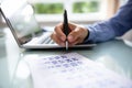 Businesswoman Marking Date On Calendar Royalty Free Stock Photo