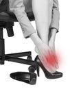 Businesswoman massaging her aching foot Royalty Free Stock Photo