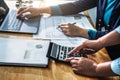 Businesswoman meeting time. accountant managers  working with new startup project. using calculator and laptop in office Royalty Free Stock Photo