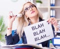 Businesswoman with message in office at desk