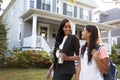 Businesswoman Mother Walking Daughter Back From School