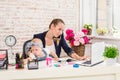 Businesswoman mother woman with a daughter working at the laptop