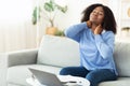 Businesswoman with neck pain after long hours at work Royalty Free Stock Photo