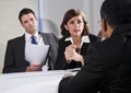 Businesswoman negotiating with men Royalty Free Stock Photo