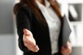 Businesswoman offer hand to shake as hello in office