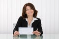 Businesswoman Offering Cheque Royalty Free Stock Photo