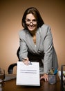 Businesswoman offering clipboard with contract