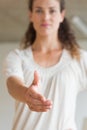 Businesswoman offering handshake in office