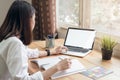 Businesswoman in office in casual shirt. Use computer for graphic designer.