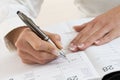 Businesswoman in office noting an appointment