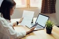 Businesswoman in office and use computer to perform financial accounting.