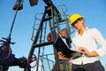 Businesswoman in an oilfield