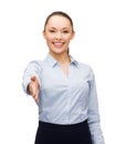 Businesswoman with opened hand ready for handshake