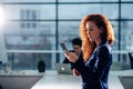 Businesswoman Outside Office On Mobile Phone Royalty Free Stock Photo