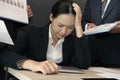 businesswoman overwhelmed with hard work. overworked woman suffering stress. exhausted secretary burnout Royalty Free Stock Photo