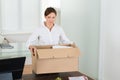 Businesswoman Packing Her Belongings Royalty Free Stock Photo