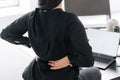 Businesswoman with pain in lower back at home Royalty Free Stock Photo